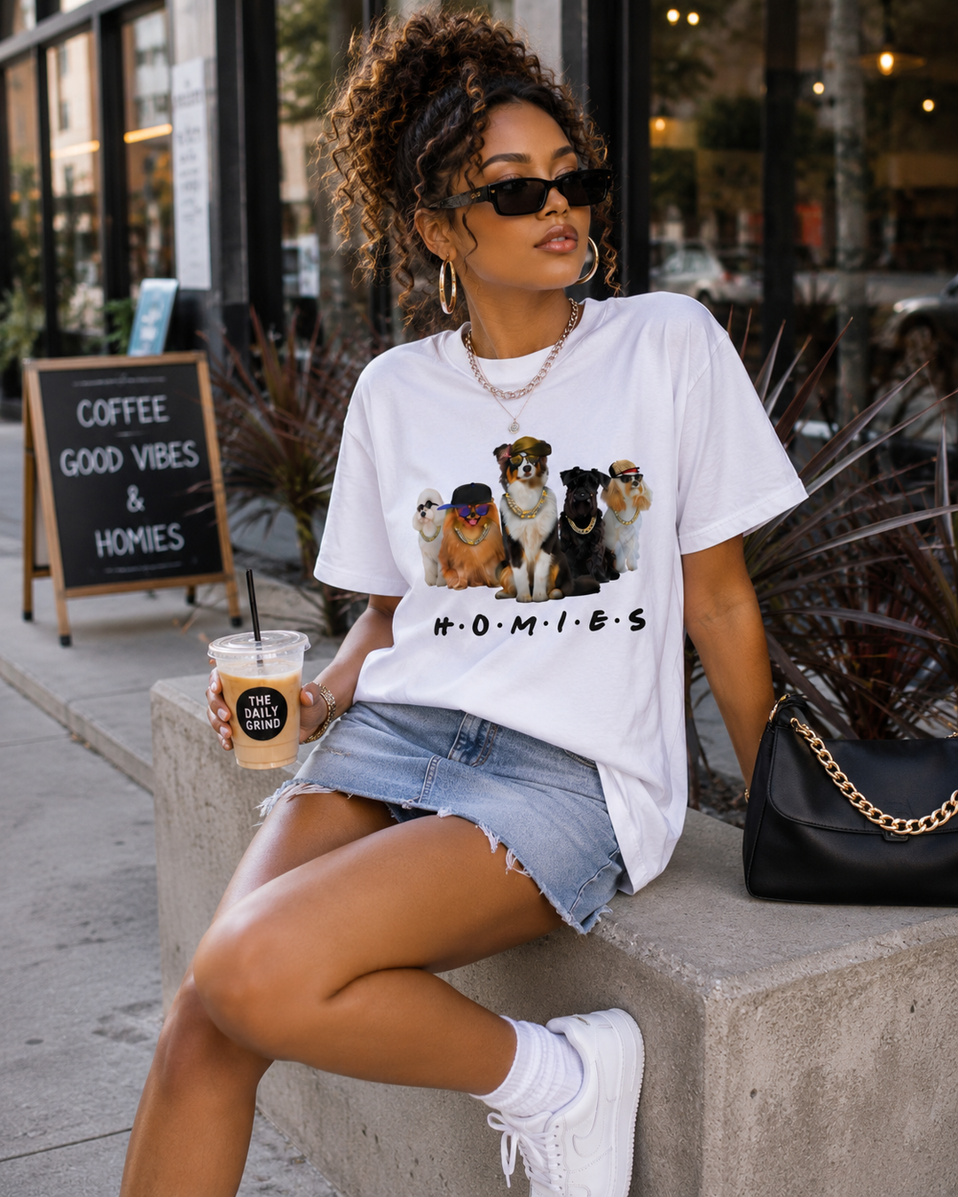 Woman wearing white Hip Hop HOMIES Australian Shepherd T-shirt at a cafe