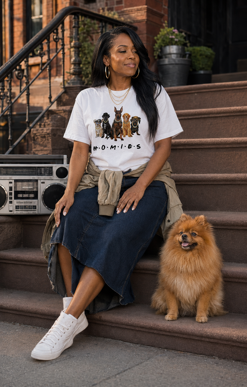 Woman wearing white Hip Hop HOMIES Doberman Pinscher T-shirt on brownstone steps